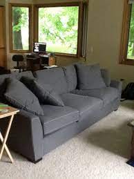 oak trim throughout dark grey sofa