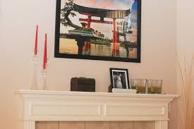 A Painting Over A Fireplace Mantel