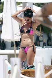 Don't tell mom the babysitter's dead. Danielle Lloyd Shows Off Her Abs In A Pink Bikini As She Parties In Ibiza