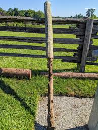 replacing fence posts at the farm the