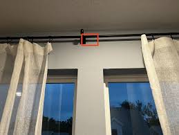 hanging curtains metal behind drywall