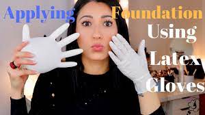 applying foundation using latex gloves