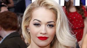 rita ora shows off abs in rolled
