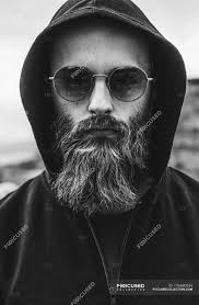 View hood investment & stock information. Portrait Of Bearded Man Wearing Sunglasses And Hood Lifestyle Freedom Stock Photo 176690934