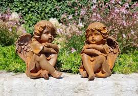 Pair Of Seated Angels In Cast Iron