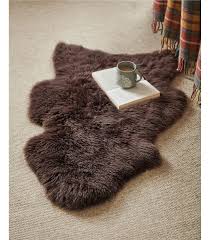 chocolate sheepskin rug woo uk