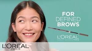 shape eyebrows with a brow stylist