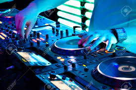 Dj Mixes The Track In The Nightclub At A Party