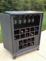 This diy wine cabinet attractively displays entertaining essentials like wine bottles and wine glasses and a drawer provides a place to store accessories. 13 Great Diy Wine Rack Ideas Hometalk