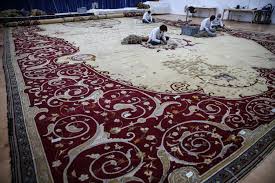 old hereke carpet undergoes restoration