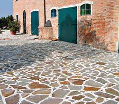The installers used a wet sandy cement and installed the marble floor tiles before installing the ceramic wall tiles. Exterior Porphyry Floor Crazy Consorzio Cavatori Produttori Porfido Soc Coop Crazy Paving Outdoor Paving Patio Stones
