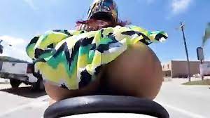 Babe on a motorcycle flashes her ass at everyone | voyeurstyle.com