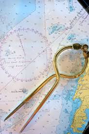 Brass Dividers Lay On A Nautical Chart Of Bermuda