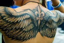 The angel wing tattoo on the chest of this guy is applied with elegance and a unique touch of art. 24 Angel Wings Tattoos And Their Deep Spiritual Connection Tattooswin