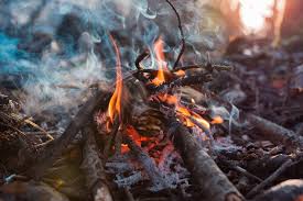 How to Build a Fire: Tips for Fireplaces, Campfires, and Dealing with Rain  | The Manual