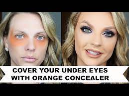 under eyes with orange concealer