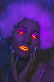 woman with neon makeup closeup 80s style