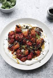 Beef and lamb meatballs baked in tahini from ottolenghi. From Ottolenghi Simple Cherry Tomatoes Are Charred And Spooned Over Yogurt The Boston Globe Ottolenghi Recipes Yotam Ottolenghi Recipes Yogurt Recipes