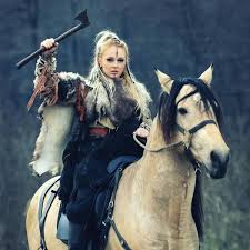 beautiful viking warrior woman holding