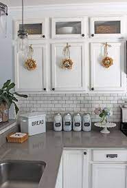 A white kitchen is like a little black dress—it never goes out of style. Simple Summer Kitchen Decorating Ideas White Kitchens White Cabinets With Gray Qua White Kitchen Decor Kitchen Cabinets Grey And White White Kitchen Design