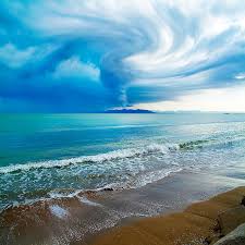 stormy weather beach clouds ocean