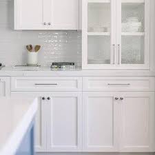 white shaker cabinet chrome hardware