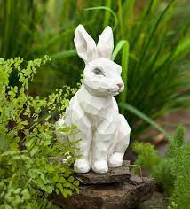 Admire A Woodcut Rabbit Statue In Your