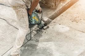 Using Jackhammer Drilling Concrete Surface