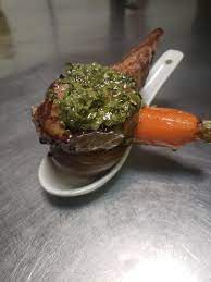 What up, kitchen bros? Today's amuse bouche is a mini version of a dinner  special I made the other night. Local lamb chop with salsa verde, baby  carrot and potato. One bite