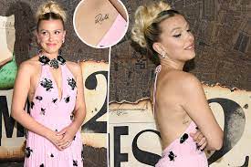 Millie Bobby Brown flashes tattoos at 'Enola Holmes 2' premiere