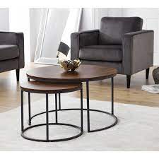 The coffee table, typically small and low, is a side table, a table encircled by chairs or a table placed in front of a sofa. Hanley Round Nesting Coffee Table