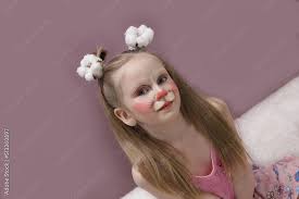 child with a funny face painting makeup