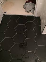 new black floor tiles grout not fully