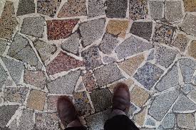 This crazy bathroom floor was created from thousands of beer bottle caps, but any bottle caps will create a multicolor penny tile effect so long as they are of uniform height. Crazy Marble Flooring An Architect Explains Architecture Ideas