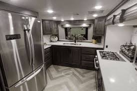 .bunk over cab bunkhouse front bath front bedroom front cargo deck front entertainment front kitchen front living kitchen island loft murphy bed outdoor entertainment outdoor kitchen rear fifth wheel. 5 Amazing Front Kitchen Fifth Wheel Trailers The Wayward Home