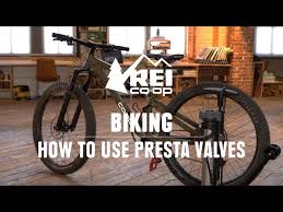 pump up a bike tire with presta valves