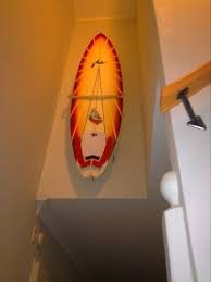 surfboard mounted in staircase