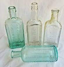 4 Antique Glass Medicine Bottles