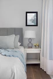 bed with grey headboard and white