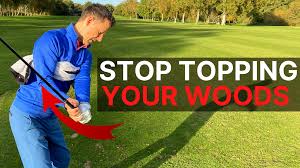 stop topping the golf ball hit your