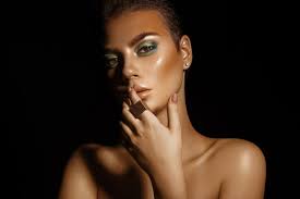 young woman with green colors makeup