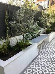White Rendered Walls And White Fencing
