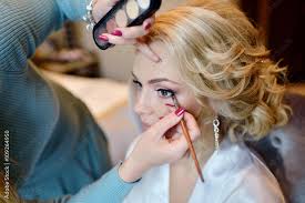 wedding makeup artist making a make up