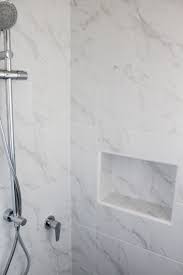 Capture the beauty of authentic marble with this classic white marble floor tile. Marble Tiles Marble Bathroom Wall Tiles Marble Bathroom Carrara Bathrooms White Bathrooms White Carrara Bathroom Marble Showers Marble Tile Bathroom