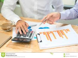 Business Man Calculating Budget Numbers Invoices And Financial