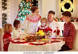 Cooking with the kids at christmas is a really fun family activity. Family With Kids Having Christmas Dinner At Tree Family With Children Eating Turkey Christmas Dinner At Fireplace And Canstock