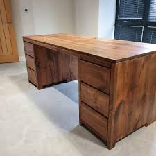 The logs and the flat surfaces of this rustic executive desk can be finished in any of the options to create a true centerpiece. Modern Rustic Home Office Study Desk Rustic Home Offices Modern Rustic Homes Pine Furniture