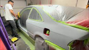 painting a car in a garage honda em1