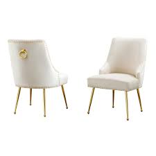 cream chairs with gold base and nail