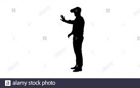 Silhouette Geschäftsmann in der virtuellen Realität Headset zu Fuß in der  virtuellen Welt Stockfotografie - Alamy